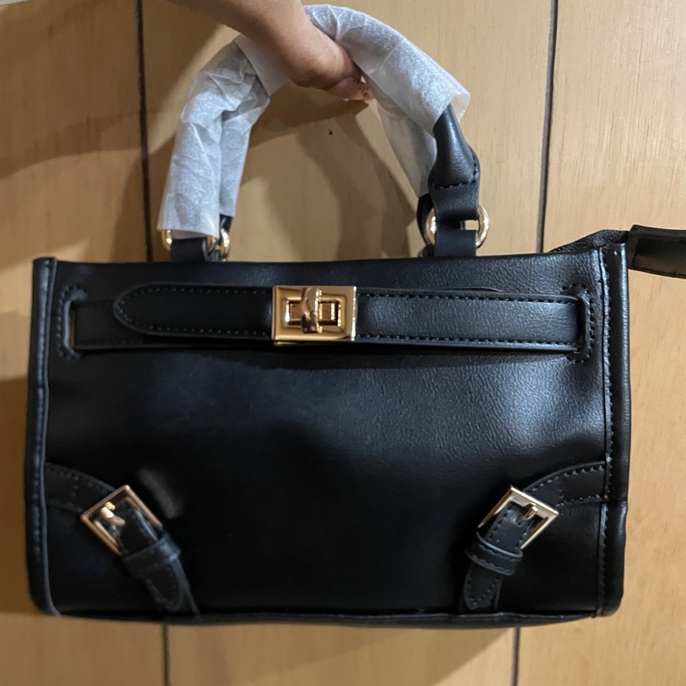 Elegant Black Handbag with Gold Accents